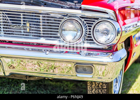 Shallow depth of field closeup of the front end details on a 1964 Ford Galaxie 500 XL convertible. Stock Photo