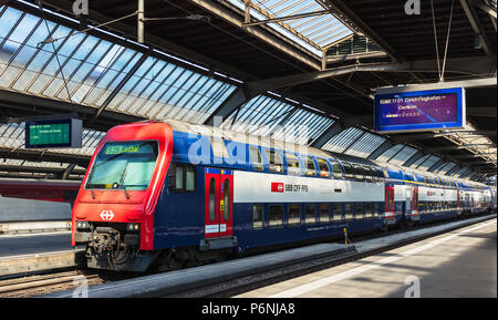 A passenger train of the Swiss Federal Railways company at a platform of the Zurich main railway station. Stock Photo