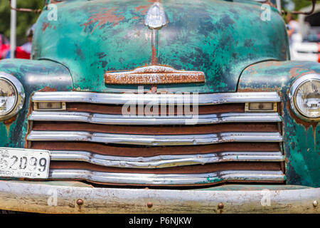 shallow depth of field closeup of the front end details on a 1950 Chevrolet 3100 pickup truck. Stock Photo