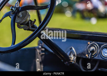 Shallow depth of field closeup of the steering wheel mechanism on a 1923 Ford Model T Touring Car. Stock Photo