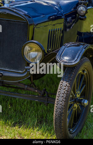 Shallow depth of field closeup of the fender and front tire on a 1923 Ford Model T Touring Car. Stock Photo
