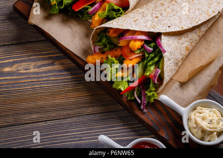 Mexican special: Tortilla with chicken and vegetables. Stock Photo