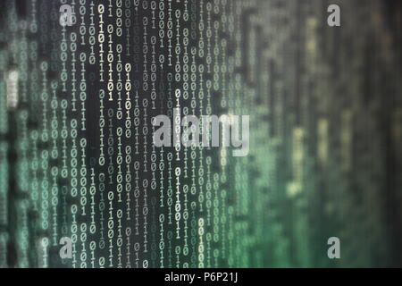 power of big data. binary code information bit on computer monitor screen display. green light text number one and zero. blur focused blue bokeh light Stock Photo