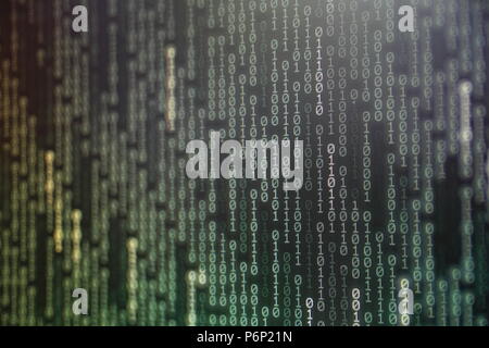 power of big data. binary code information bit on computer monitor screen display. green light text number one and zero. blur focused blue bokeh light Stock Photo