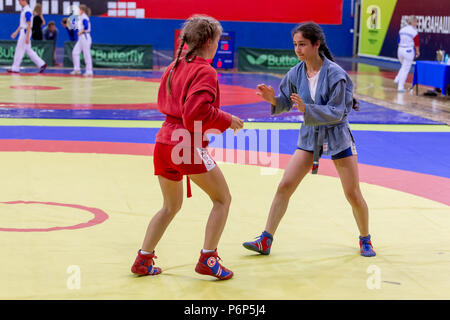 Russia, Vladivostok, 06/30/2018. Sambo competition among girls born in 2003-2004. Teenage tournaments of martial arts and fighting sports. Stock Photo