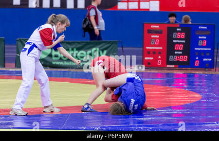 Russia, Vladivostok, 06/30/2018. Sambo competition among girls born in 2003-2004. Teenage tournaments of martial arts and fighting sports. Stock Photo