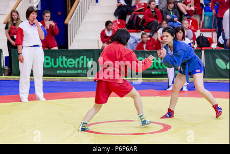 Russia, Vladivostok, 06/30/2018. Sambo competition among girls born in 2003-2004. Teenage tournaments of martial arts and fighting sports. Stock Photo