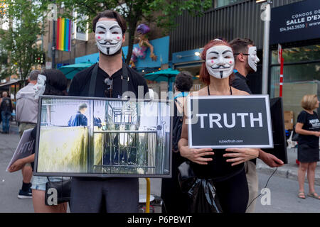 Montreal, Canada - 1 July 2018: "Anonymous for Voiceless" vegan animal activists showing footage of factory farming Stock Photo