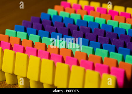 Rows of brightly colored pencil erasers lined up in an OCD orderly fashion with an even lighting and contrastand a Moderate depth of field Stock Photo