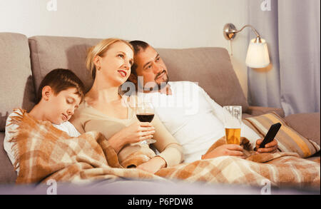 Family Couple Watching TV News Sitting o... | Stock Video | Pond5