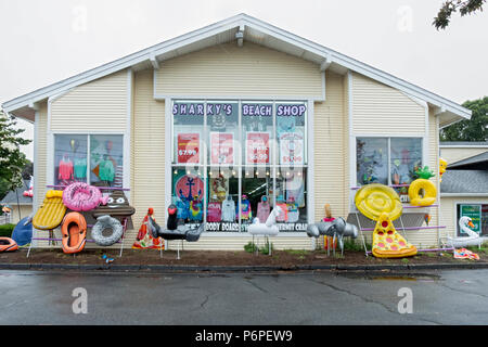 The exterior of SHARKY'S BEACH SHOP in  West Yarmouth, MA. Large inflatables adorn the outside. Stock Photo