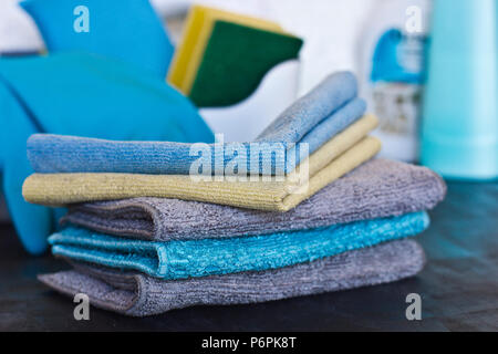 Cleaning stuff. Blue and grey microfiber napkins on the black ground Stock Photo