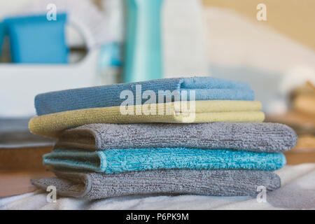 Cleaning stuff. Blue and grey microfiber napkins on the black ground Stock Photo