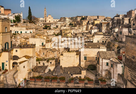 Sasso Barisano, cave dwelling district in Gravina Gorge, UNESCO World Heritage Site, Matera Cathedral in distance, in Matera, Basilicata, Italy Stock Photo