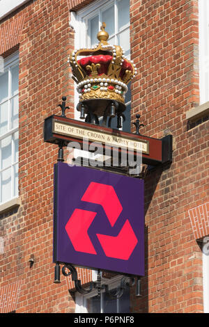 Natwest bank sign below a crown and sign for the site of the crown and family hotel on the High Street in Guildford, Surrey, UK Stock Photo