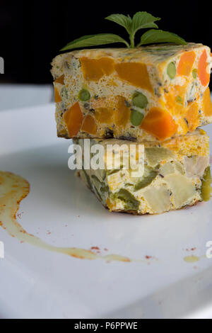 Vegetable pudding with fresh herbs Stock Photo