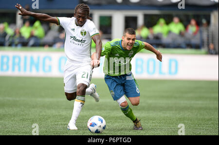 Seattle, Washington, USA. 30th June, 2018. The Sounders VICTOR RODRIGUEZ (8) and the Timbers DIEGO CHARA (21) battle for the ball as the Portland Timbers play the Seattle Sounders in a Western Conference match at Century Link Field in Seattle, WA. Credit: Jeff Halstead/ZUMA Wire/Alamy Live News Stock Photo