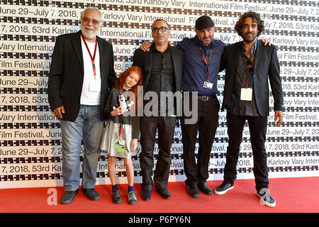 Karlovy Vary, Czech Republic. 01st July, 2018. From left: producer Marek Rozenbaum, actress Emily Granin with The Little Mole toy, Israeli director Joseph Madmony, actor Moshe Folkenflik and producer Jonathan Rozenbaum pose in front of a photo wall at a news conference to Madmony's film Redemption/Geula during the 53d International Film Festival in Karlovy Vary (KVIFF), Czech Republic, on July 1st, 2018. Credit: Slavomir Kubes/CTK Photo/Alamy Live News Stock Photo