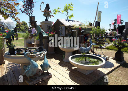 East Molesey,UK,2nd July 2018,Mad Hatters Tea Party ornaments on Press Day at the RHS Hampton Court Palace Flower Show which runs from the 2nd-8th July 2018. It is the largest flower show in the world covering over 34 acres with the centre piece being the long walk. There are various gardens to admire and gain ideas from along with plant, flower stalls and various other garden features. Credit Keith Larby/Alamy Live News Stock Photo