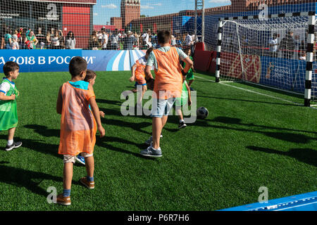 FIFA World Cup, Moscow, Monday, July 02, 2018. Hot and sunny day in Moscow. Football fans, international tourists and Muscovites entertain themselves near the Kremlin. A football area is arranged on Red Square. International teams of kids and adults play football (soccer). People can play also table football and engage themselves in a variety of activities devoted to football (soccer), World Cup, and sport in general. Future champions. Credit: Alex's Pictures/Alamy Live News Stock Photo
