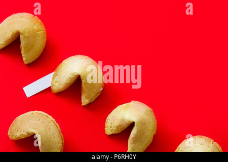 Fortune cookies pattern on red background. C Stock Photo