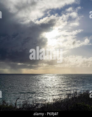 The sun hiding behind storm clouds over the St Vincent Gulf, SA, Australia. Stock Photo