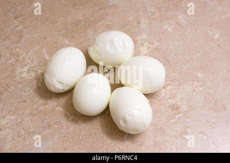 five chicken eggs lie on the table Stock Photo