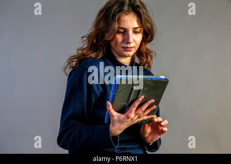 Young woman using a digital tablet. Paris, France. Stock Photo