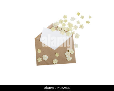 Brown paper envelope with greeting blank card and white flying flowers isolated on white Stock Photo