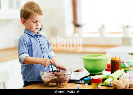 Cute child learning to become a chef Stock Photo