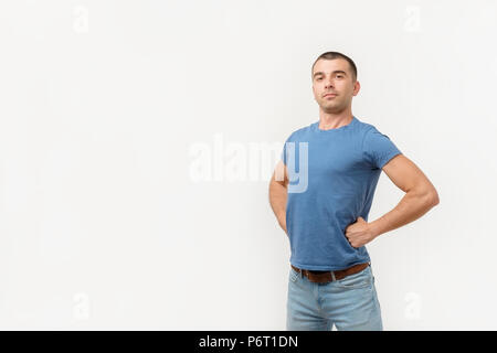 Handsome young man standing like a super hero Stock Photo