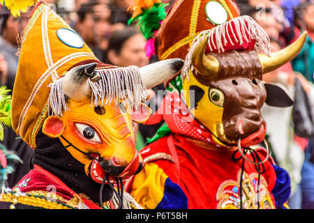 Parramos, Guatemala - December 28, 2016: Traditional folk dancers in masks & costumes near UNESCO World Heritage Site of Antigua Stock Photo