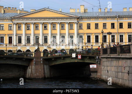 The Tripartite Most, also called Three-Arched Bridge or Theater Bridge, in St. Petersburg, Russia, in front of an old building from the tsar ages Stock Photo