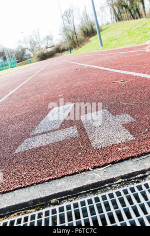 red rubber racetracks in outdoor stadium Stock Photo - Alamy