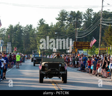 A line of World War II vintage military Jeeps in the 4th of July parade in Speculator, NY USA held on June 30, 2018. Stock Photo