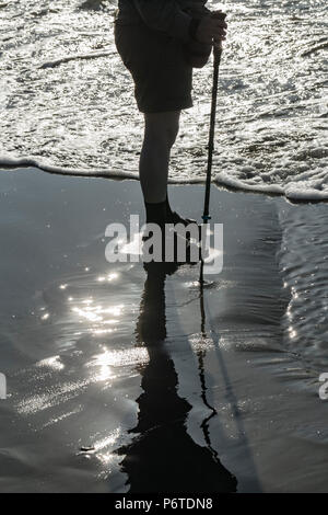 Karen Rentz hiking on Shi Shi Beach along the Pacific Ocean in Olympic National Park, Washington State, USA Stock Photo