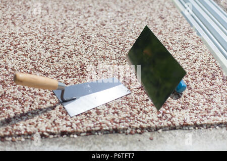Coloured Concrete Around Pool with tools Stock Photo