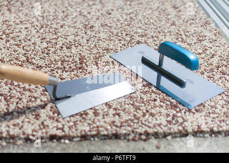 Coloured Concrete Around Pool with tools Stock Photo