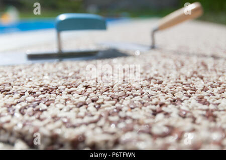 Coloured Concrete Around Pool with tools Stock Photo