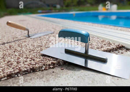 Coloured Concrete Around Pool with tools Stock Photo