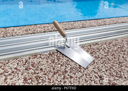 Coloured Concrete Around Pool with tools Stock Photo
