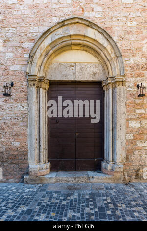 Old wooden door  in Foligno Stock Photo