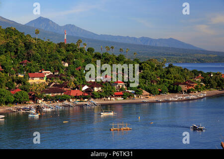 Indonesia, Bali, East Bali, Amed, Amed Village and Gunung Agung Volcano Stock Photo