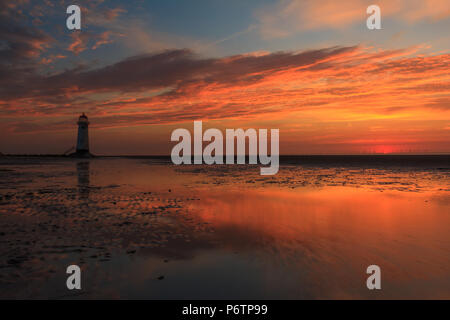 Sunset at Point of Ayr (Talacre) lighthouse, on the North Wales coast Stock Photo