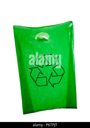 Green plastic bag isolated on white, old reused bag. Stock Photo