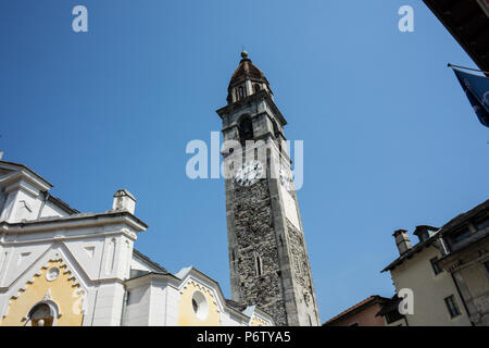 Clock tower of Chiesa Parrocchiale dei Santi Pietro e Paolo at center square in Ascona, Locarno, Switzerland wit blue sky Stock Photo