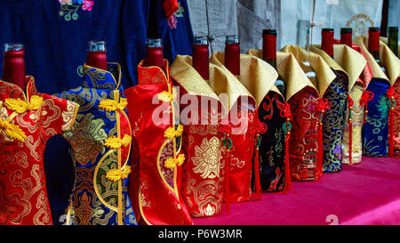 Bottles dressed in special costumes. Stock Photo