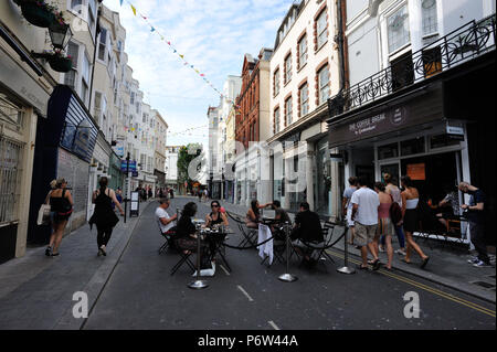 Alfresco dining in the middle of the street in Brighton, English Seaside Town, Brighton & Hove, East Sussex, England, UK Stock Photo