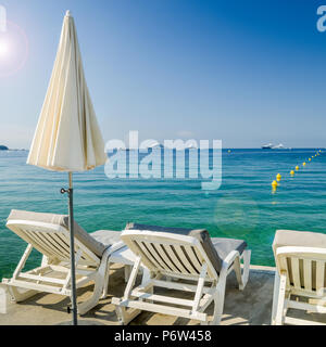 Rows of empty beach lounges in Juan les Pins, France Stock Photo