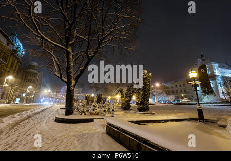 LVIV, UKRAINE - FEBRUARY 04, 2018: Beautiful night winter cityscape in the center of Lviv city. Some lens flare flrom lamps available. Stock Photo